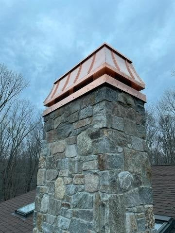 Custom straight panel copper chimney cap installed on stone chimney close detail — hand-fabricated by Archaic Metal Berlin NJ