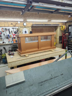 Kynar copper tone board and batten top vent cap, full front profile on workbench
