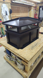Kynar black board and batten chimney cap, front view showing solid base and vented top section