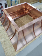 Interior top-down view of custom copper chimney shroud showing open base construction and standing seam detail