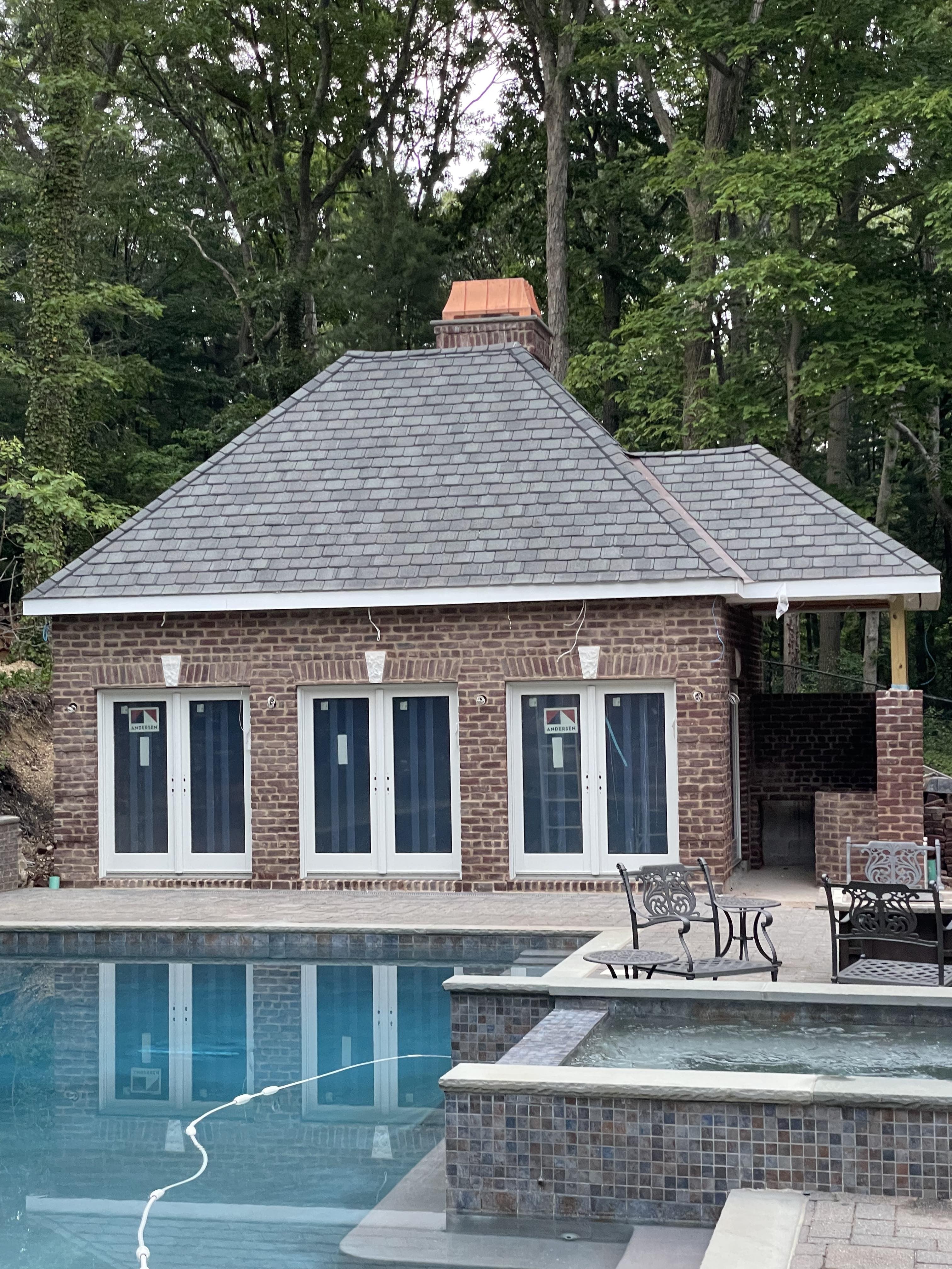 Custom copper chimney shroud installed on pool house brick chimney, Archaic Metal hand-fabricated architectural metalwork