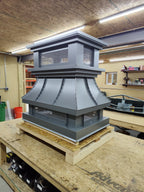 Kynar gray crown top vent cap, clean front view showing stepped crown and mesh screen