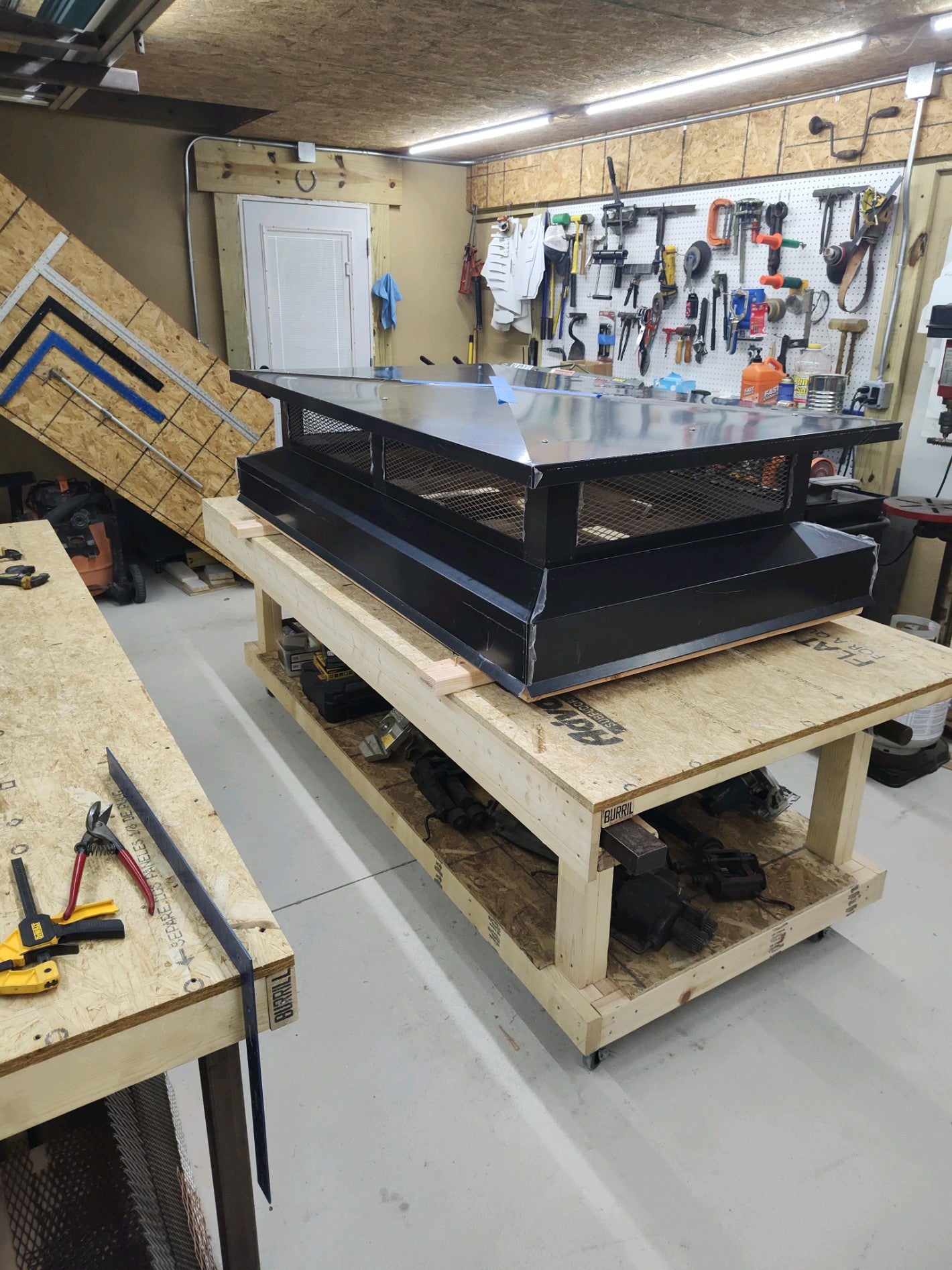 Large custom multi-flue chimney cap in black Kynar aluminum — shop view showing full scale, Berlin NJ