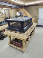Custom multi-flue cap with hip top lid in black Kynar — front view showing mesh screen panels