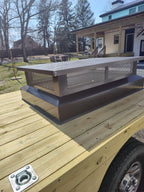 Custom multi-flue chimney cap installed — black Kynar aluminum, rooftop view