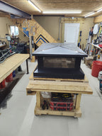 Multi-flue chimney cap three-quarter view — black Kynar aluminum, expanded stainless steel mesh