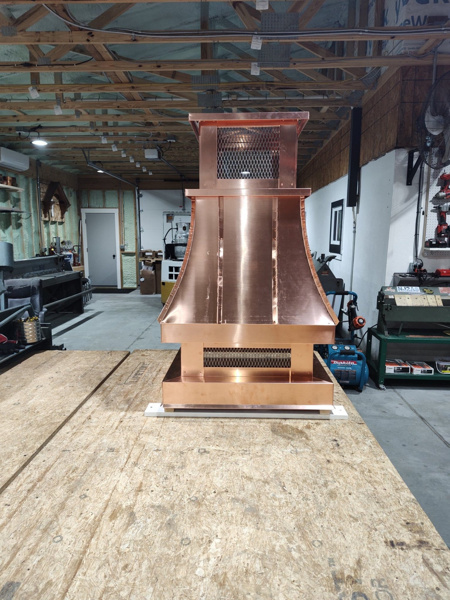 Custom copper top vent curved panel chimney cap, front view, hand-fabricated by Archaic Metal