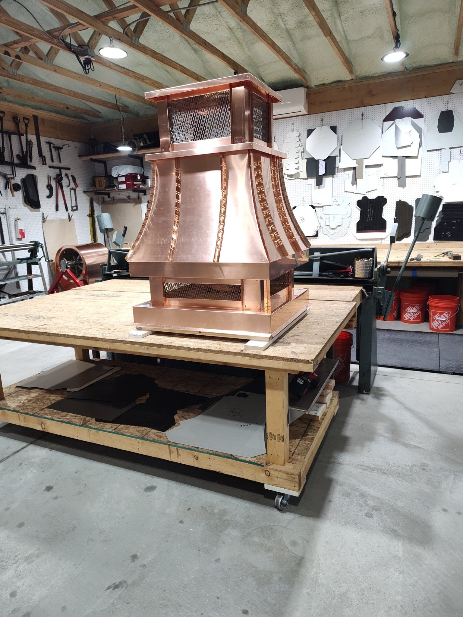 Copper curved panel chimney cap with riveted seam detail, single-flue proportions