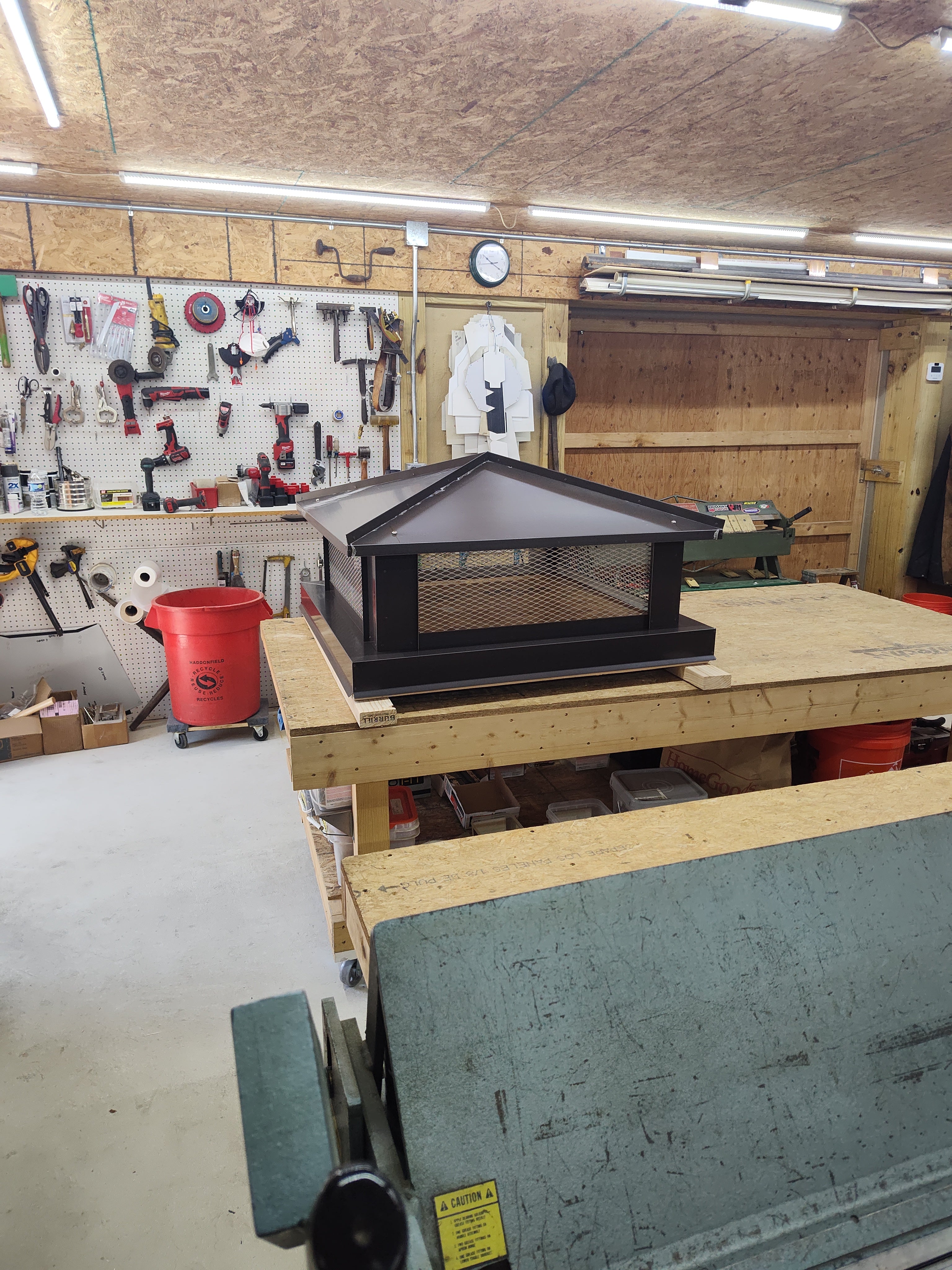 Black Kynar aluminum hip roof chimney cap in Archaic Metal workshop Berlin NJ

