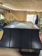 Top view of black Kynar aluminum chimney cap lid — hand-fabricated by Archaic Metal, Berlin NJ