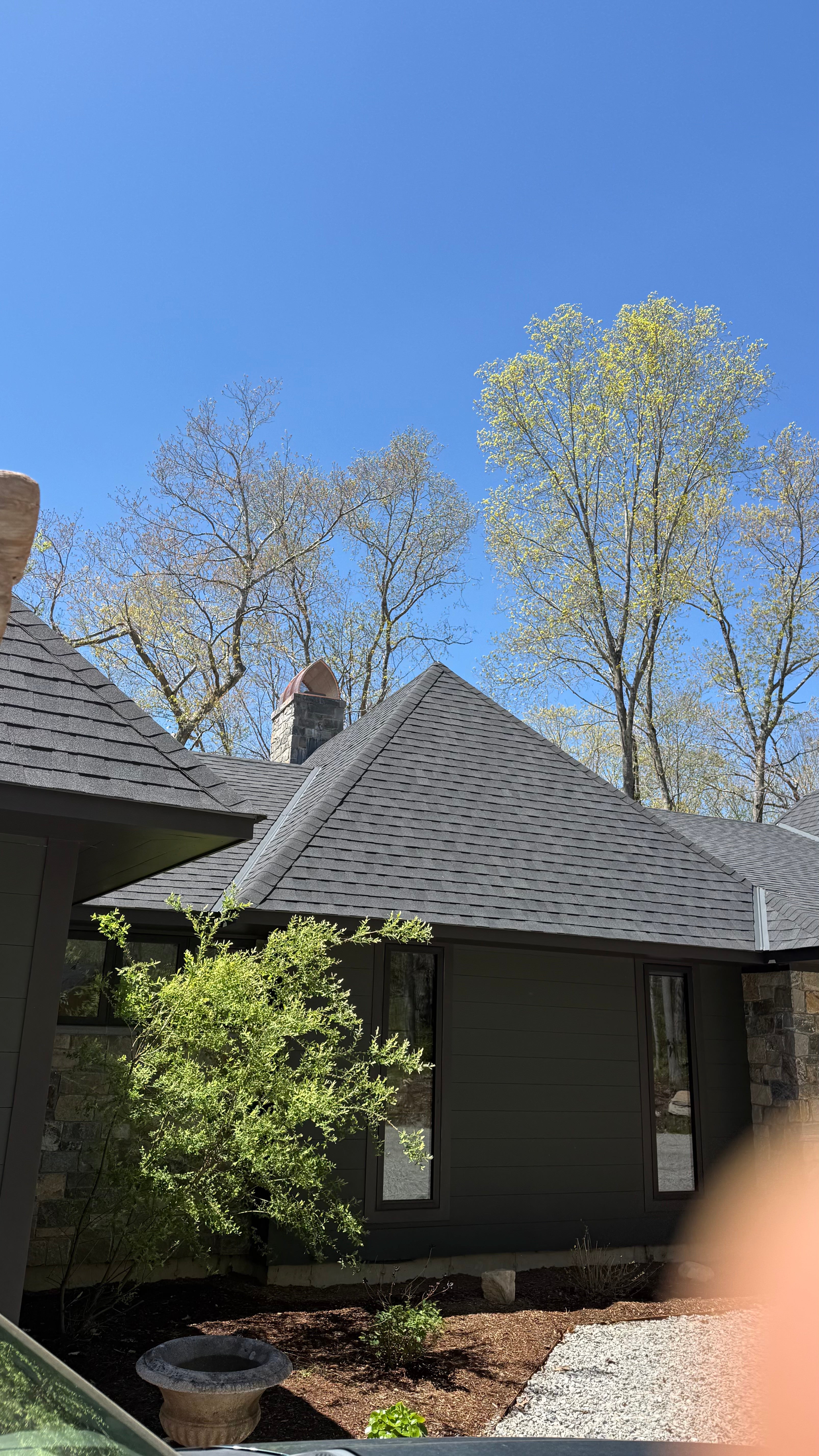 Custom copper arched cathedral chimney cap installed on stone chimney, Connecticut