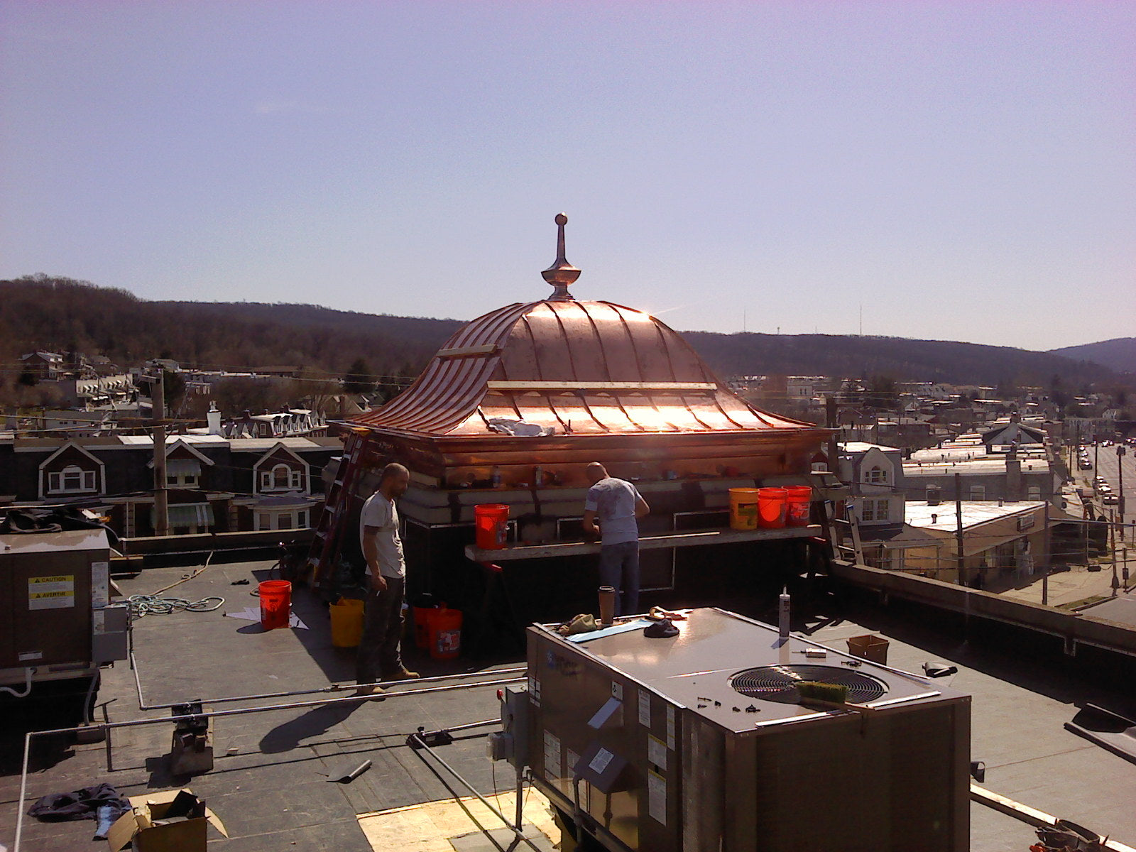 Custom copper bell roof with standing seam panels, built-in copper gutter, and hand-fabricated roof finial – Archaic Metal, NJ