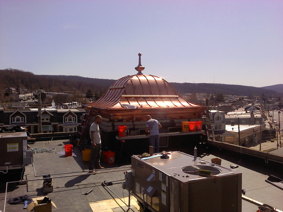 Custom copper bell roof with standing seam panels, built-in copper gutter, and hand-fabricated roof finial – Archaic Metal, NJ