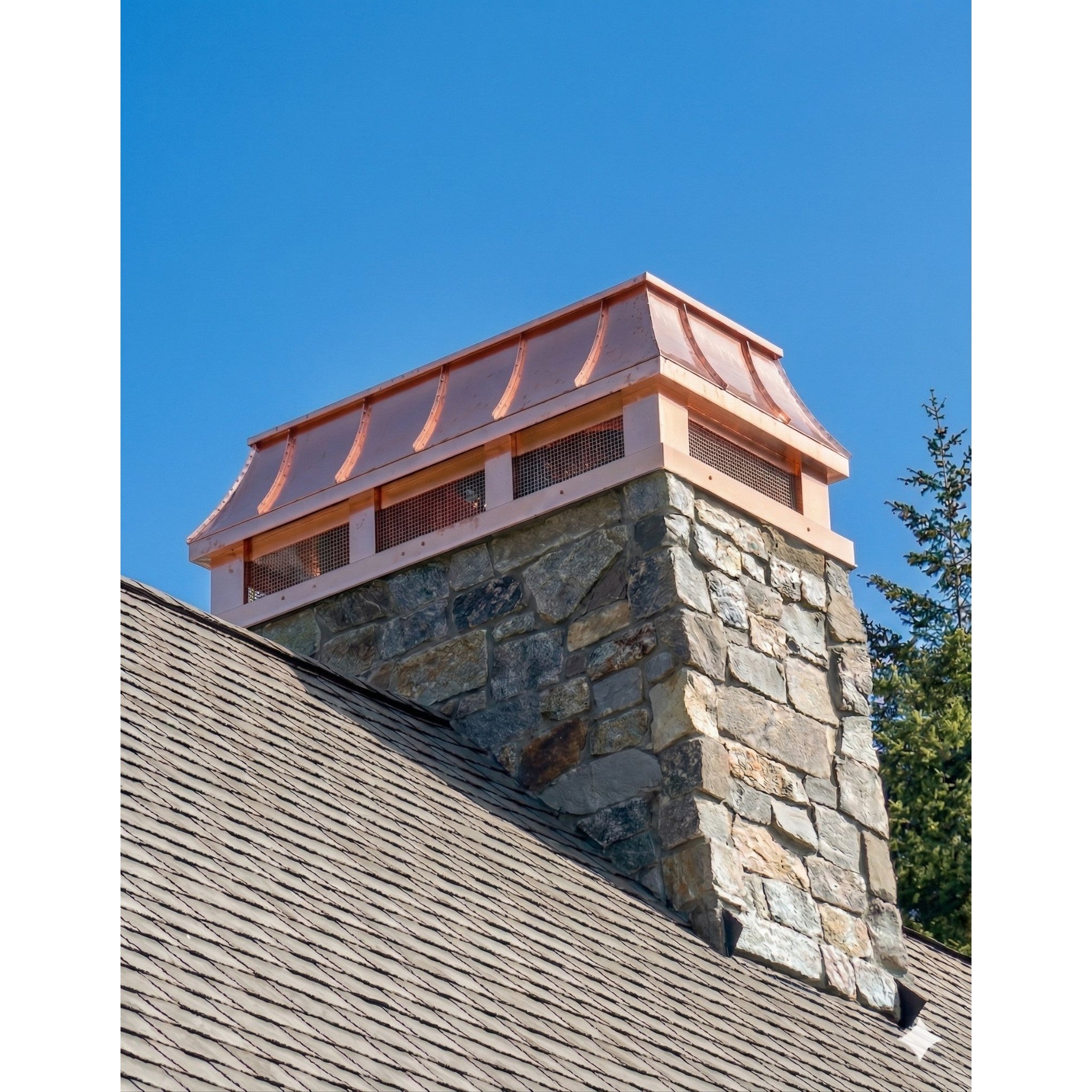 Custom copper curved panel chimney cap installed on stone masonry chimney — hand-fabricated by Archaic Metal, Berlin NJ
