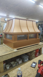 Custom curved panel copper chimney cap side mount with removable lid and stainless mesh

