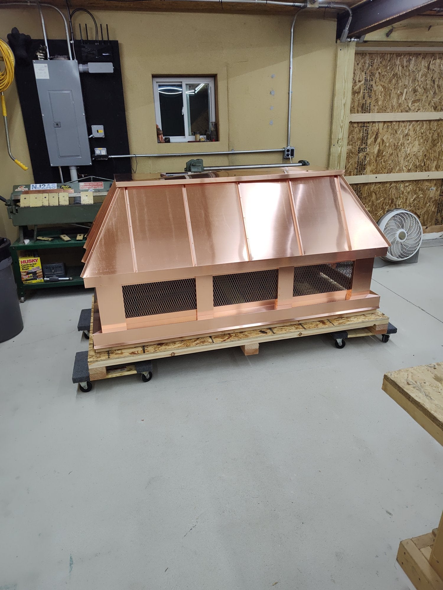 Extra long straight panel copper chimney cap on shipping pallet — custom fabricated by Archaic Metal Berlin NJ