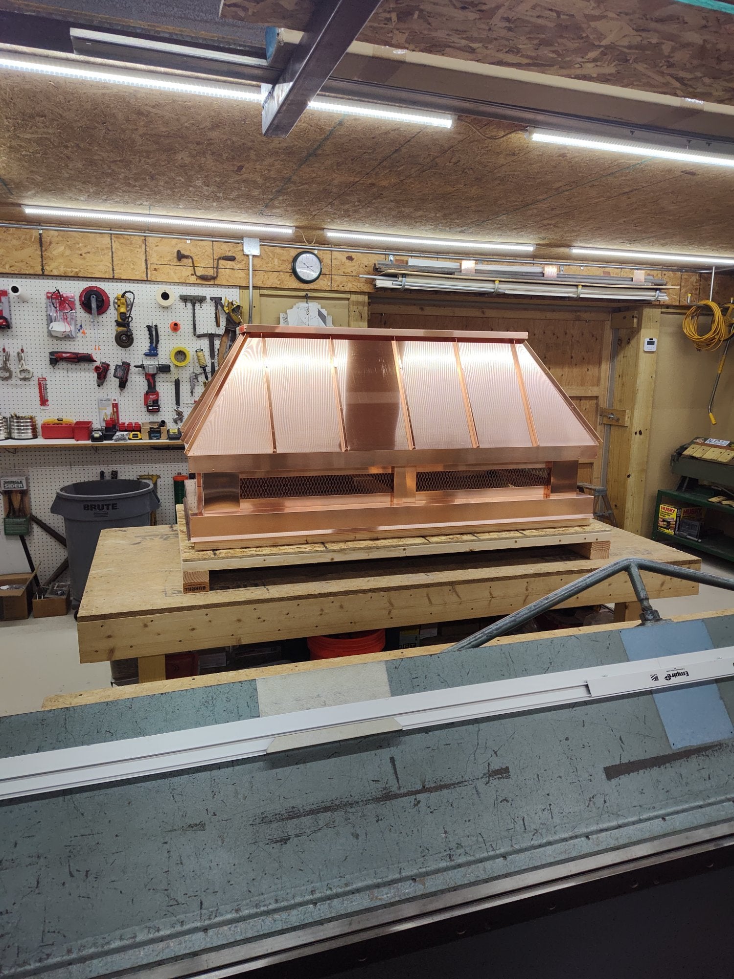 Large custom straight panel copper chimney cap shop front view showing standing seam panels — Archaic Metal Berlin NJ