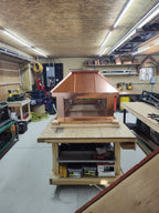 Square custom straight panel copper chimney cap front view on workbench — hand-fabricated by Archaic Metal Berlin NJ