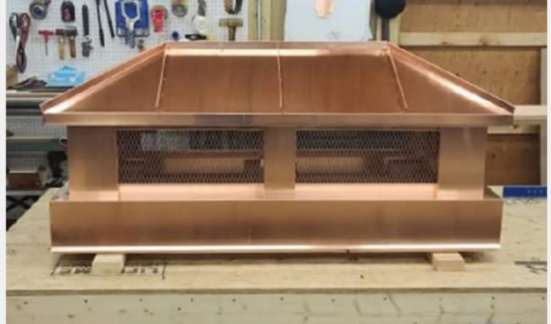 Custom hip and ridge copper chimney topper — hand-fabricated by Archaic Metal

