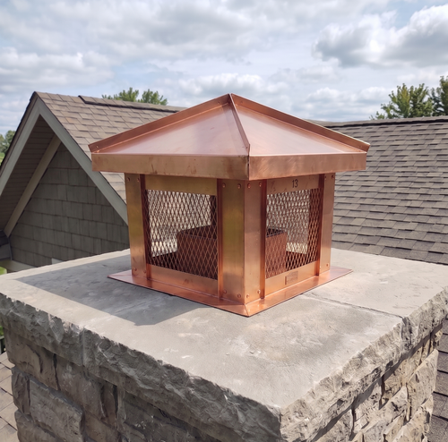 Custom 16oz Copper 14×14 flue cover installed on brick chimney crown — top mount, stainless steel mesh screen, free shipping
