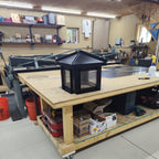 Custom hip and ridge chimney flue cover in Kynar black aluminum — hip roof profile and aluminum spark screen, hand-fabricated in Berlin NJ