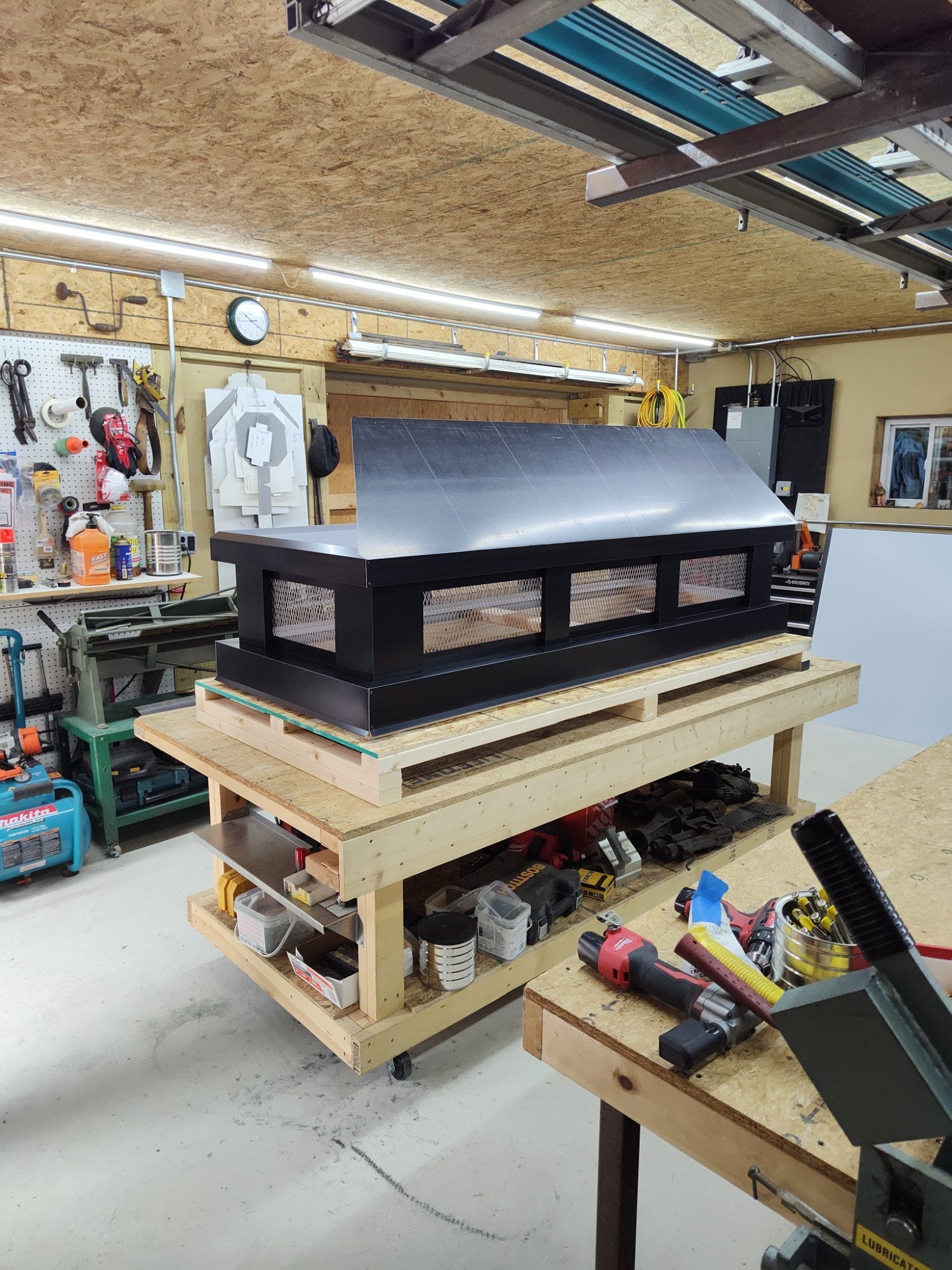 Custom black Kynar aluminum straight panel chimney cap side view showing removable lid — hand-fabricated by Archaic Metal Berlin NJ