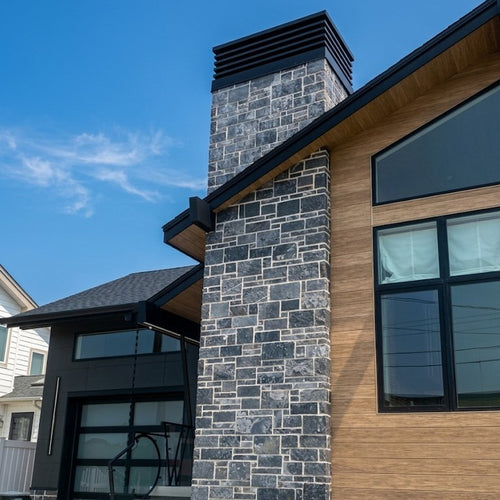 Custom louvered chimney cap on modern stone chimney — mid century modern design by Archaic Metal Berlin NJ