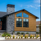 Custom chimney shroud on modern home with stone chimney — louvered chimney cap by Archaic Metal