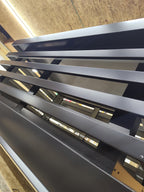 Close-up of custom louvered chimney cap horizontal panels in Kynar aluminum fabricated by Archaic Metal