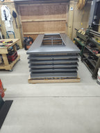 Batch of custom louvered chimney caps stacked in fabrication shop ready to ship — Archaic Metal Berlin NJ