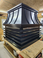 Large custom modern louvered chimney cap in shop — black Kynar aluminum, multi-flue size, fabricated to order by Archaic Metal in Berlin NJ