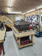 Premium hip roof chimney cap in dark bronze Kynar finish — hand-fabricated to order

