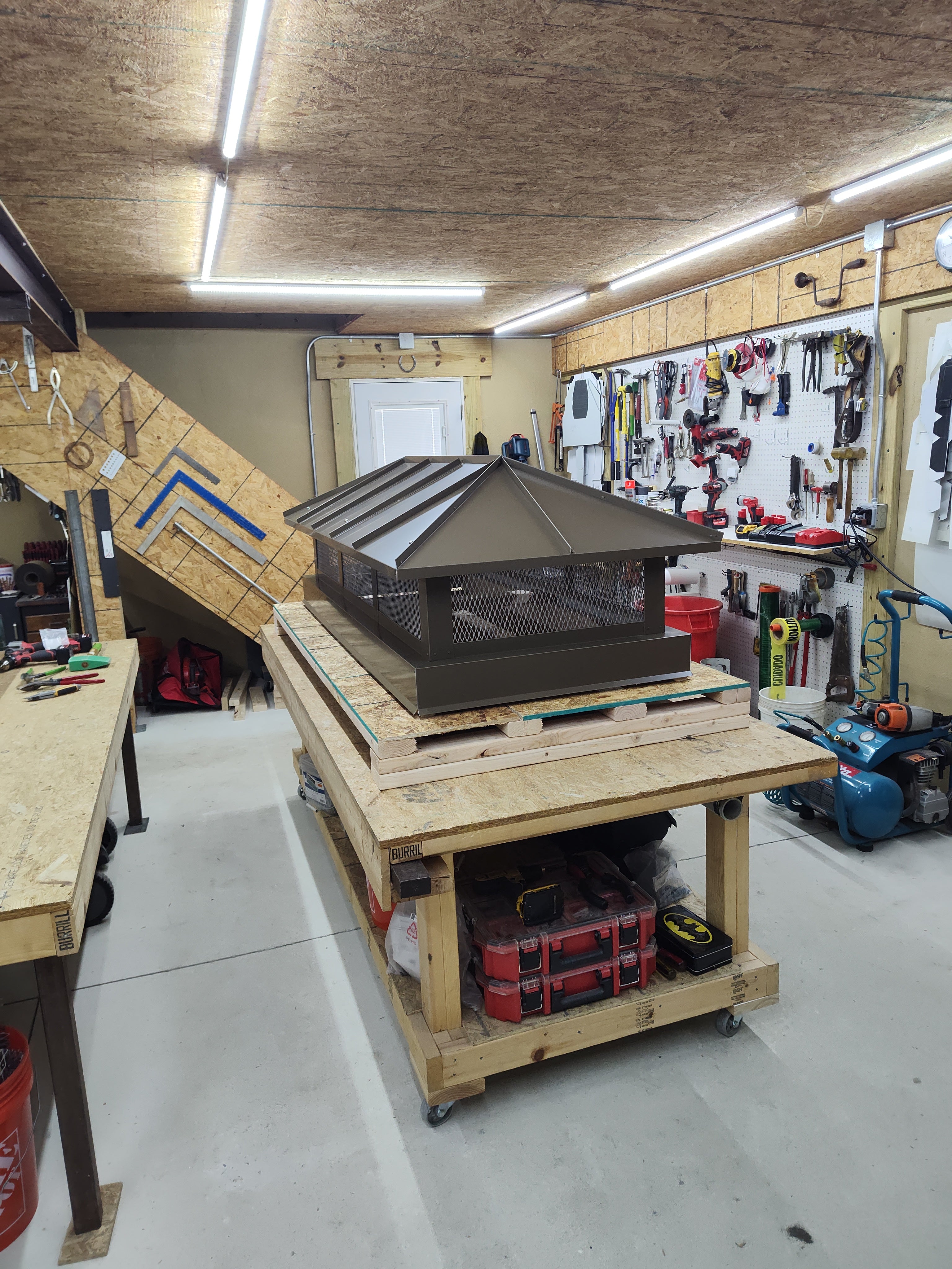 Premium hip roof chimney cap in dark bronze Kynar finish — hand-fabricated to order

