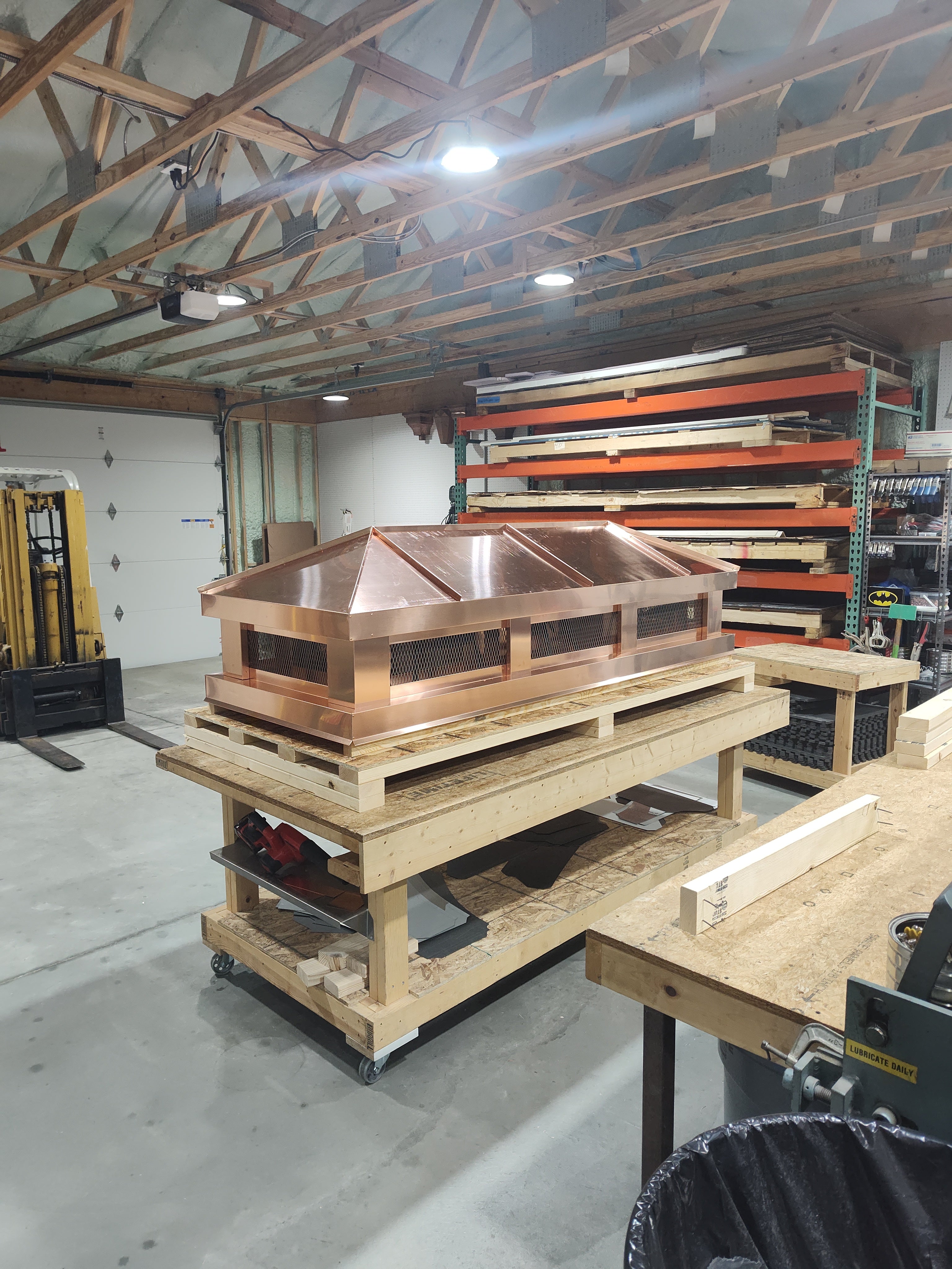 Shiny new copper hip and ridge chimney cap — 16oz copper fabricated in Berlin NJ

