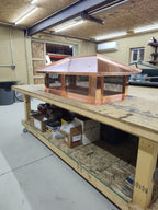 Custom Kynar aluminum hip chimney cap on rooftop — handcrafted by Archaic Metal

